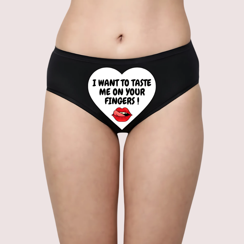 Black underwear with a heart design and 'I WANT TO TASTE ME ON YOUR FINGERS! 'text. Naughty Quotes Printed Panties. Customized Temptation Panty - A Secret Message.