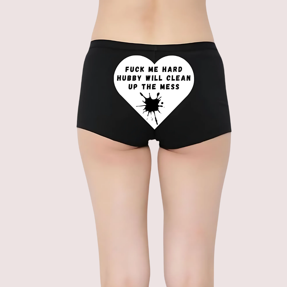 Black underwear with a white heart graphic and 'FUCK ME HARD HUBBY WILL CLEAN UP THE MESS' text. Personalized Naughty Text Panties for Her.