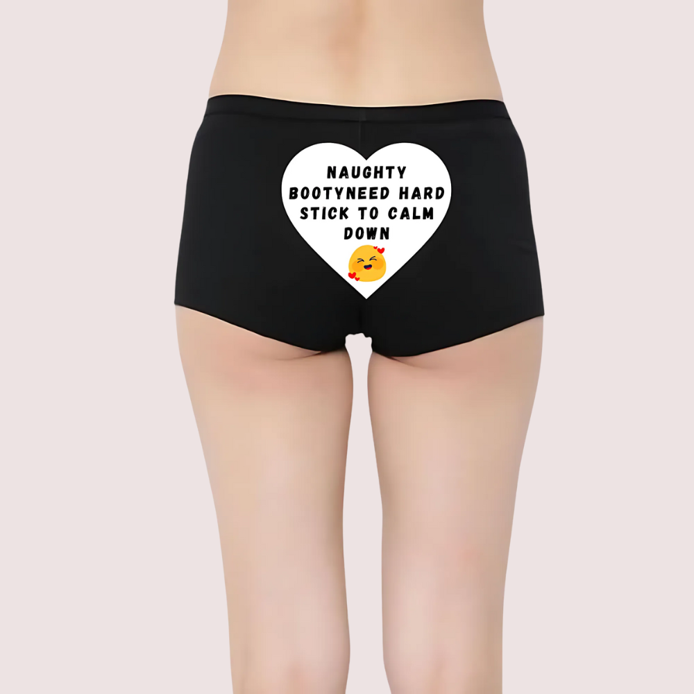 Black shorts with a heart-shaped graphic and 'NAUGHTY BOOTY NEED HARD STICK TO CALM DOWN' text. Naughty Quotes Printed Panties. Tease and Please Playful Personalized Panty. Tease and Please Playful Personalized Panty